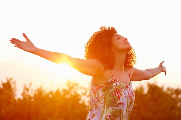 woman embracing the sunlight